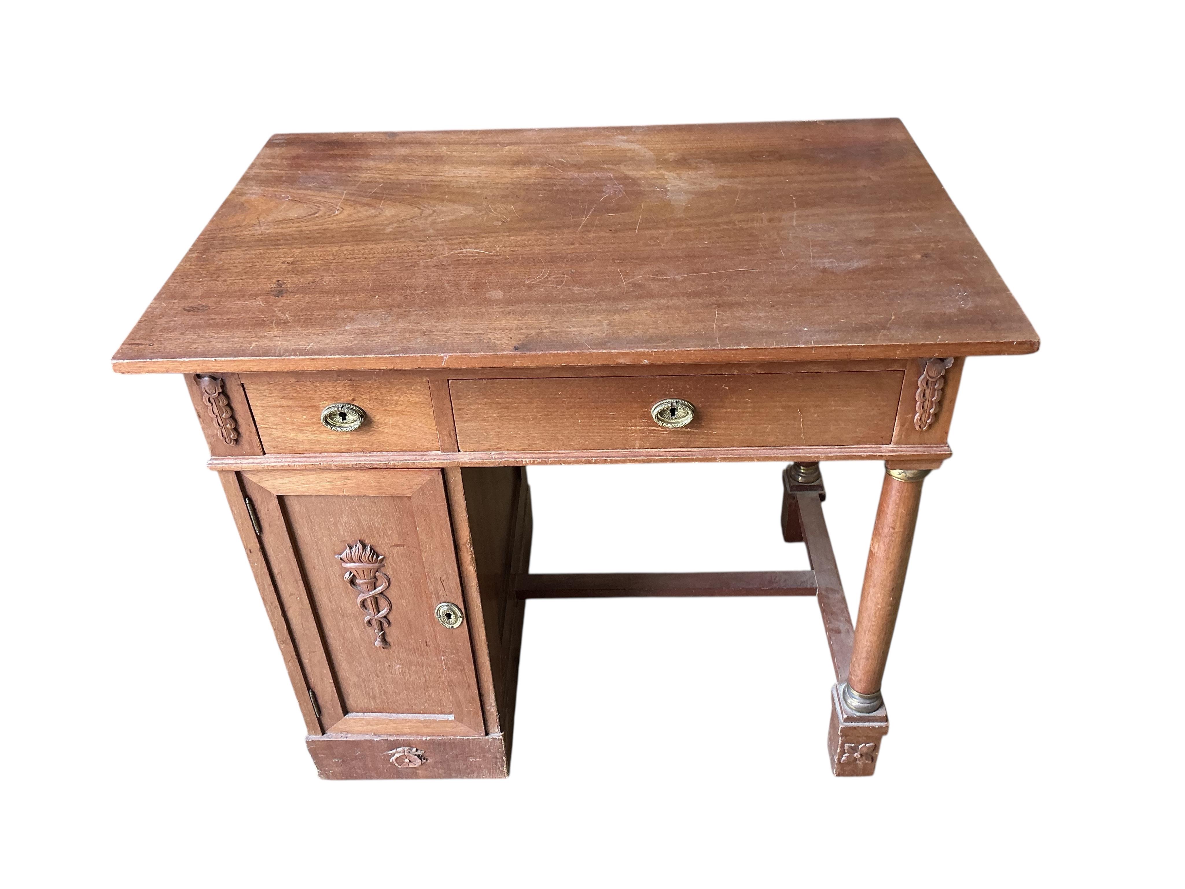 A French Empire style mahogany kneehole dressing table, width 90cm, depth 60cm, height 77cm